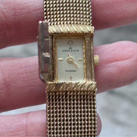 Anne Klein Accessories - Anne Klein Diamond Collection
Gold Tone Hidden Face Thin
Strap Watch